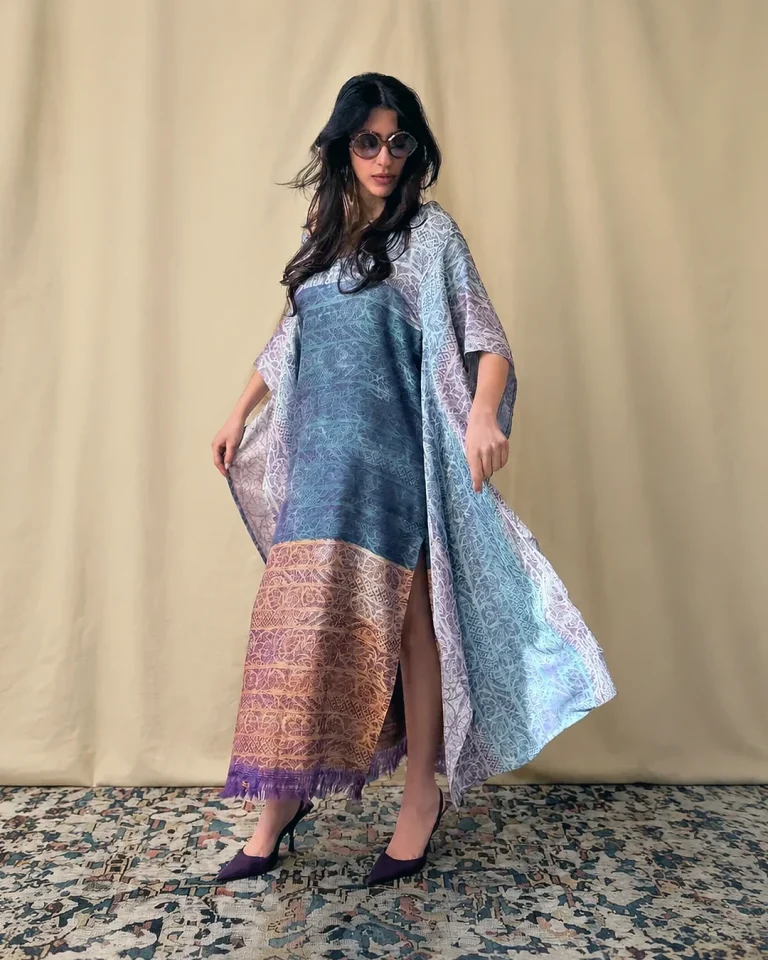 Full-length view of the Atlas Abaya from the CUSP Spring/Summer 2026 collection, featuring a loose silhouette, open sleeves, and a palette of blue, lilac, and gold