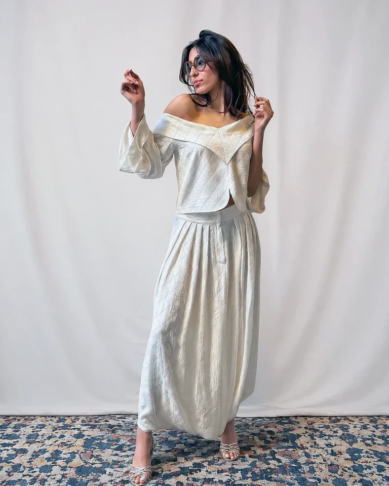 Full-length view of the Sepid blouse and culottes in embossed silk with an off-shoulder neckline and fluid wide-leg silhouette