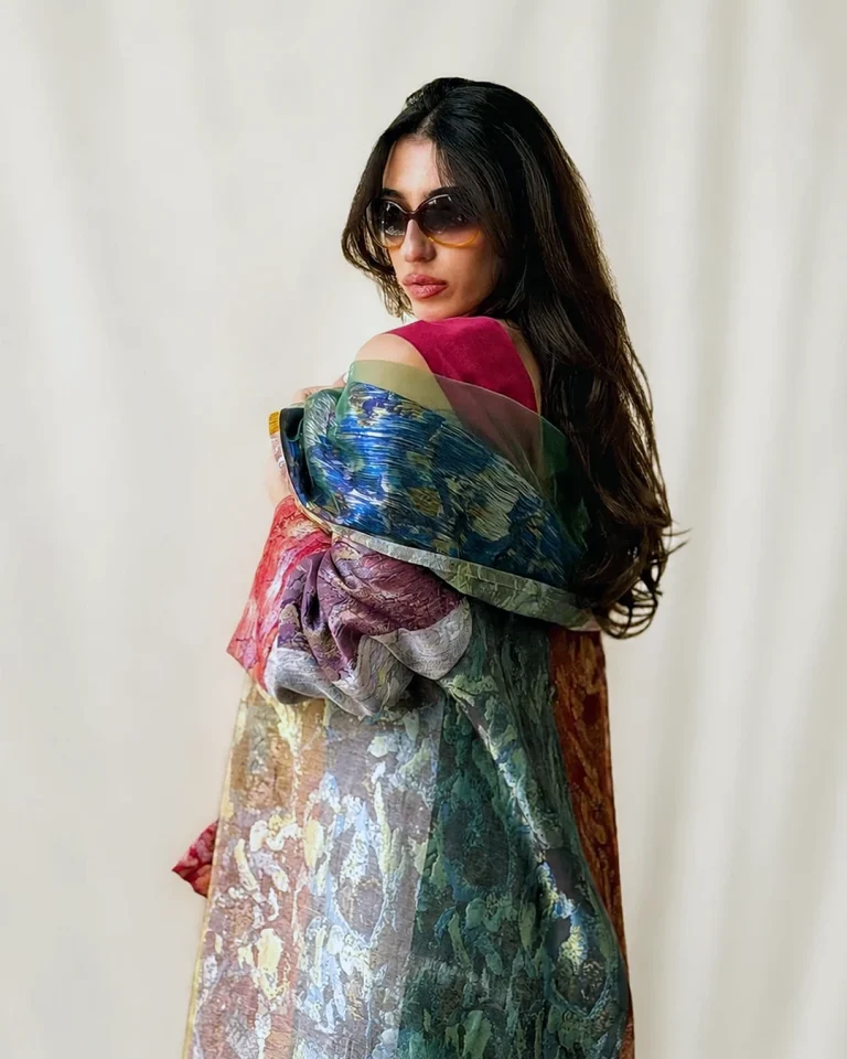 Close-up view of the Atlas Daraei Aba in semi-sheer handwoven silk with layered green, blue, and burgundy tones