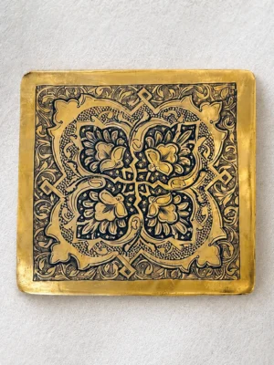 Square hand-engraved brass panel with a symmetrical floral motif and arabesque border, Isfahan qalamzani