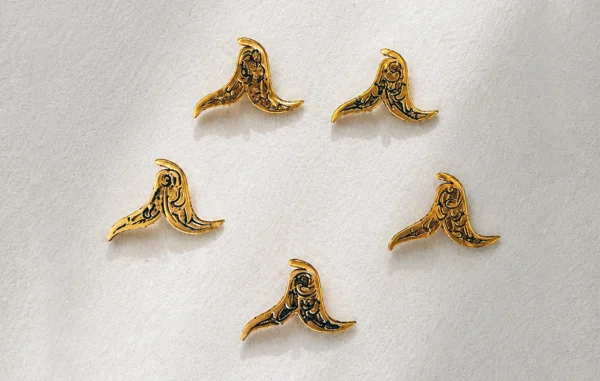 Bird-shaped hand-engraved metal ornaments with arabesque motifs, handcrafted Iranian buttons